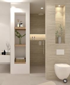 a bathroom with a toilet, sink and shelves on the wall next to each other