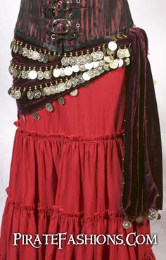 a woman's red skirt with buttons and chains on it