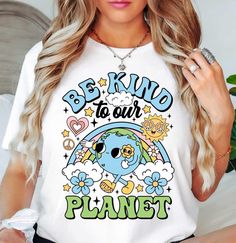 Be Kind to our Planet Retro (Tee) | Earth Day Fashion | Unisex Pre-Shrunk T-Shirt   Embrace the spirit of Earth Day with our stylish and comfortable t-shirts. These tees are crafted with a conscious nod to adorable graphics of our planet Earth. These t-shirts embody the visualization of reducing, reusing, and recycling in a stylish way. Join the movement towards a greener future with each purchase, knowing that you're actively participating in the cycle of sustainability. Celebrate Earth Day eve Earth Day Fashion, Our Planet Earth, Day Fashion, Retro Graphics, Retro Tee, Planet Earth, Our Planet, Earth Day, Be Kind