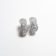 NOTE: Some of the smaller diamonds have little chips. MATERIAL: 18K white gold (marked) WEIGHT: 6.7 grams  DIAMONDS:  Each earring holds 29 brilliant cut diamonds.  The 58 are I1 clarity and I in color.  Approx total weight of 0.50 cts MEASUREMENTS: 3/8" x 3/4" EXTRA: The earrings are French clip type with omega backs for pierced ears. They hold brilliant cut diamonds.  This is a pretty pair. NOTE: All items are sold as is. If there is anything wrong with the piece, it will be stated in the description. Let me know if you have any problems. PICTURES: Pictures are enlarged to show detail. SEE DESCRIPTION FOR SIZE DETAILS. MAKE SURE THEY MATCH WHAT YOU NEED. Gemstones or metal may appear to be slightly different in color upon arrival (light or dark) due to different monitor screen settings a French Clip, Fine Jewellery Earrings, Clip Earrings, Round Brilliant Cut Diamond, Brilliant Cut Diamond, Round Brilliant, Ear Piercings, Clip On Earrings, Diamond Earrings