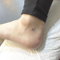 a person with a small tattoo on their foot