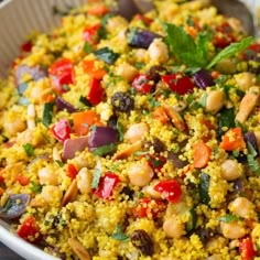 a white bowl filled with rice and vegetables