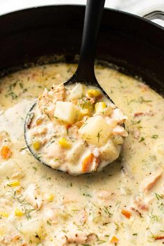 a ladle full of chicken pot pie soup