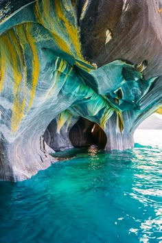 the water is blue and green with yellow streaks on it's sides, as seen from below