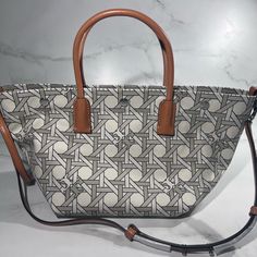 Tory Burch Canvas Basketweave New Ivory Basketweave Tote Crossbody Bag Nwt Msrp $350 Brand New Never Worn With Out Original Price Tags- They Fell Off And Store Had To Make A New Add A Vintage Touch To Your Look Accessorizing With The Statement Tory Burch Canvas Basket Weave Small Tote Bag. Sku: #9842457 Cotton Material Construction. Zipper Closure. Two Top Handles For Hand Carry; Single Shoulder Carry Handle. Signature Double T Accent Motif. Intricate Design Allover. Imported. Measurements: Heig White Rectangular Bag With Intrecciato Weave, White Intrecciato Weave Bag For Travel, White Intrecciato Weave Travel Bag, Luxury Cream Shoulder Bag With Intrecciato Weave, Designer White Bags With Intrecciato Weave, Luxury White Shoulder Bag With Intrecciato Weave, Luxury Cream Intrecciato Shoulder Bag, Luxury White Intrecciato Weave Shoulder Bag, Cream Coated Canvas Crossbody Shoulder Bag