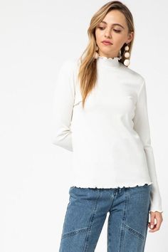 Sleek turtleneck top with 90s lettuce ruffle trim in white. Turtle Neck White, Winter Wishlist, Frill Tops, White Turtleneck, Turtleneck Top, Hey Girl, Turtle Neck Top, Ruffle Trim, Lettuce