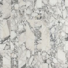 white and black marble tiles are arranged in an irregular pattern, which is very similar to each other