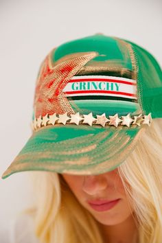 Add some festive flair to your outfit with our GRINCHY GREEN TRUCKER HAT! Featuring hand crafted stars and eye-catching gold detailing, this holiday fun accessory is perfect for those who don't take themselves too seriously. Don't be a grinch, grab one today! All orders are currently shipping within 14 business days. To receive item quicker, expedited shipping is available at checkout. **All Christmas orders must be placed with expedited shipping to guarantee delivery by Dec. 24 if placed after Trendy Green Hat For Festivals, Trendy Green Hat For Festival, Trendy Green Festival Hat, Green Trucker Hat, Last Day To Order, Christmas Delivery, Christmas 2024, Grinch, Holiday Fun