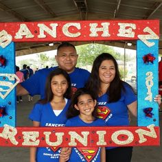 the family is posing for a photo in their blue shirts