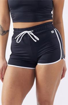 You will move with ease from land to sea in these stretch-enhanced swim shorts topped with a high waist. 3 1/2" inseam   Lined   80% recycled polyester; 20% spandex   Hand wash, line dry   Imported Summer Workout Shorts Made Of Elastane, Sporty Swim Trunks With Built-in Shorts, Sporty Black Swimwear With Built-in Shorts, Compression Shorts For Summer Athleisure, Summer Compression Athleisure Shorts, Summer Compression Shorts For Athleisure, Summer Compression Athletic Shorts, Summer Compression Sportswear Athletic Shorts, Athleisure Compression Shorts For Summer