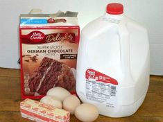 eggs, milk, and cake ingredients on a wooden table