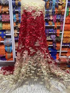 a display in a store filled with lots of different colored ribbons