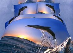 the dolphin is jumping out of the water in front of the ocean bedding set