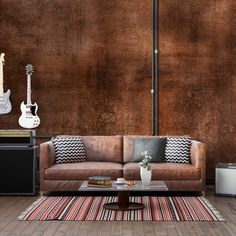 a living room filled with furniture and guitars