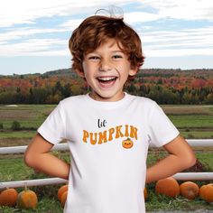 Fall festivals, pumpkin patches and apple picking...all of these activities are made a little sweeter with this Lil' Pumpkin tee!  It features the cutest little pumpkin you ever did see with a retro vibe font.  Even better is you can grab one for the whole family, even the dog, and pick those pumpkins or eat those caramel apples in style.   Want matching shirts for some fun family pics? Mommy Pumpkin Short Sleeve Tee https://www.etsy.com/listing/1770650245/mommy-pumpkin-unisex-jersey-short-sleeve Daddy Pumpkin Short Sleeve Tee https://www.etsy.com/listing/1756473892/daddy-pumpkin-unisex-jersey-short-sleeve The fabric is 100% cotton for solid colors. Polyester is included for heather-color variants. These fabrics are prime materials for printing. The shoulders have twill tape for improved d Playful Pre-shrunk T-shirt For Fall, Playful Short Sleeve T-shirt For Fall, Playful Short Sleeve Fall T-shirt, Fall Festivals, Halloween Shirts Kids, Pumpkin Patches, Family Pics, Apple Picking, Fall Kids