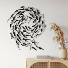 a large group of fish swimming in the ocean wall decal on a white wall