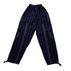 Nice comfy pants for going to the beach, camping, or spending the day at home.These hippie pants have 2 pockets on the front + 2 cargo pockets +1 pocket on the back.They are high-waisted boho pants. They have a drawstring in the waist. It was handmade by Ecuadorian artisans using the foot-treadle loom technique.Materials:75% cotton and 25% acrylic Measurements:Waist circumference: stretches from 24" up to 34"Hip circumference: 42"Rise: 11"Inseam: 28"Total Length: 39"Thigh: 12"Leg opening: 8" Car Hippie Shorts, Blue Cargo Pants, Hippie Headbands, Pants Comfy, Boho Yoga, Going To The Beach, Hippie Pants, Yoga Headband, Stretchy Headbands