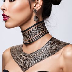 a woman wearing a black neck piece with geometric designs on the top and bottom part