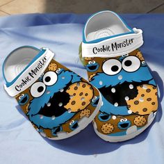 two children's shoes that have been painted to look like cookie monster