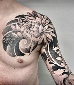 a man with a flower tattoo on his chest