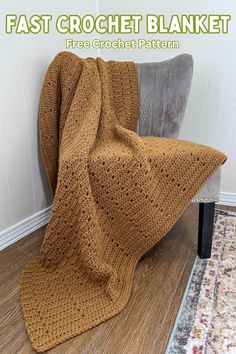 a crocheted blanket sitting on top of a chair