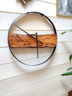 a clock made out of wood and metal