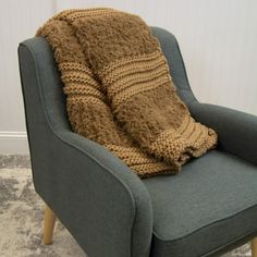 a chair with a blanket on top of it