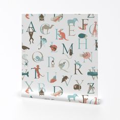 an image of a wrapping paper with animals and letters printed on it in various colors