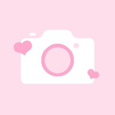 a pink camera with hearts on it