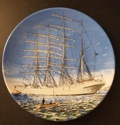 a plate with a painting of a ship on it