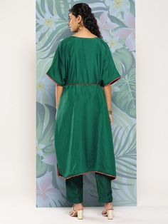 Green embroidered Kurta with TrousersKurta design:Solid with placement embroideryKaftan shapeRegular styleV-neck, three-quarter extended sleevesZari detailCalf length length with flared hemCotton blend machine weave fabricComes with a fabric beltTrousers design:Solid TrousersPartially elasticated waistbandSlip-on closure Kurta Designs, Fabric Belt, Thread Work, Yellow Floral, Shapewear, Three Quarter, Lace Detail, Woven Fabric, Quality Fabric