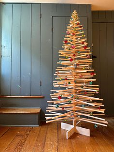 a christmas tree made out of wooden sticks