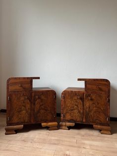 two pieces of furniture sitting on top of a hard wood floor