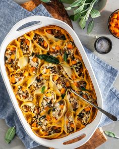 a casserole dish filled with pasta and vegetables