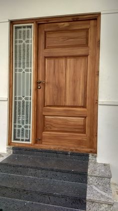 a wooden door on the side of a building