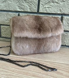 All our garments are new, handmade, unused, high quality craftsmanship, from genuine material. They have been processed through a professional cleaning. Nothing is reused or recycled.  DETAILS: *Made from mink fur *Handmade  *Magnet closure *Pull through chain strap *Dimensions: 20cm X 15cm *Beige color *Made in Greece The real color of the item may be slightly different from the pictures shown on website caused by many factors such as brightness of your monitor and light brightness Feel free to Luxury Faux Fur Evening Bag, Rectangular Shoulder Bag For Winter Evenings, Luxury Evening Bags In Faux Fur, Winter Evening Rectangular Shoulder Bag, Brown Faux Fur Rectangular Shoulder Bag, Winter Evening Bag In Faux Fur, Luxury Faux Fur Rectangular Shoulder Bag, Winter Evening Bags In Faux Fur, Winter Evening Bags With Faux Fur