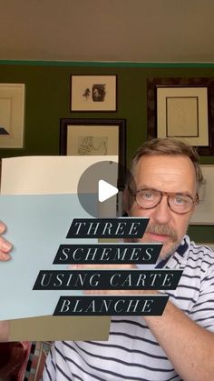 a man is holding up some type of sign in front of him with the words three schewes using carte blanciie