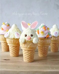 an ice cream cone filled with cupcakes and decorated as easter bunnies in the shape of bunny ears