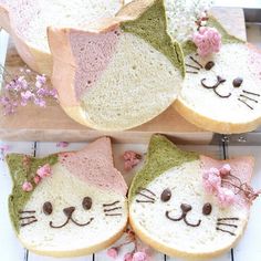 three slices of bread with cat faces on them