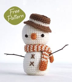 a crocheted snowman with a hat and scarf