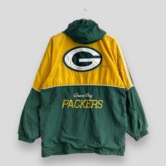 "REMINDER: THIS IS USED CLOTHING PLEASE DO NOT EXPECTED IT LIKE TO BE NEW OR IN PRISTINE CONDITION Feel free to contact me for any question. I'll assist you with my pleasure. Vintage 1990s Green Bay PACKERS Windbreaker Xlarge Starter Nfl American Football Team Sportswear Packers Yellow/Green Hoodie Coat Size XL *All measurements are taken with the garment flat on the ground. SIZE ON TAG :- Size XL ACTUAL SIZE MEASUREMENT :- ARM PIT TO ARM PIT :- 24\" inches BACK COLLAR TO HEM :- 31.5\" inches CONDITION :- DISTRESSED CONDITION. HAVE DISCOLORATION AND STAINS (KINDLY REFER TO THE PICTURES ATTACHED) ** WE ARE USING DHL EXPRESS, IT TAKES 3-5 WORKING DAYS ONLY TO ARRIVE. PLEASE LEAVE YOUR PHONE NUMBER ON THE NOTE WHILE MAKE A PURCHASE** REF : (09-08-2020) R378" 90s Style Green Track Jacket For Sports, Retro Hooded College Windbreaker, Throwback Windbreaker For Winter Sports, Throwback Winter Sports Windbreaker, Vintage Hooded Track Jacket, Winter Sports Throwback Windbreaker, 90s Green Sports Windbreaker, Throwback Sports Track Jacket, 90s Green Sports Outerwear