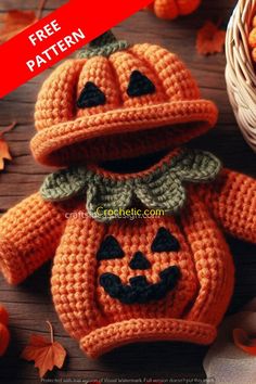 a crocheted pumpkin with a hat on it's head sitting next to some leaves