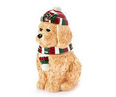 a figurine of a dog wearing a hat and scarf