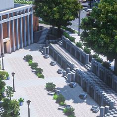 an aerial view of a courtyard with trees and benches