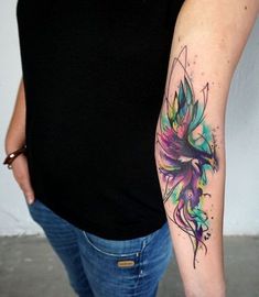 a woman with a colorful tattoo on her arm