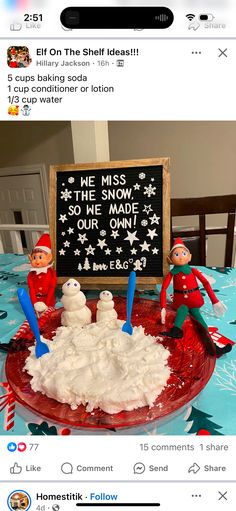 an elf is sitting in front of a snowman cake