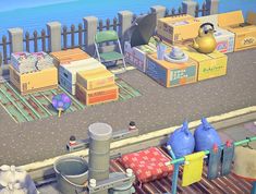 an image of a game scene with boxes and other items on the ground next to water