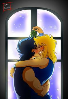 a couple hugging each other in front of a window