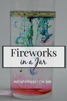 a glass filled with liquid and the words fireworks in a jar