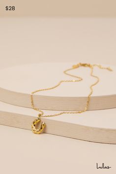 Let everyone know you're the cutest cowgirl around with the Petit Moments Horse Shoe Gold Charm Necklace! Shiny, gold-toned metal shapes this darling necklace composed of an ultra-slender chain that supports an adorable horseshoe charm with a wavy, textured design across the surface, for a vintage-inspired effect. Chain Measures 16" Long With a 2" Extender Chain. Lobster clasp closure. 100% Stainless Steel. Imported. Lulus | Horse Shoe Gold Charm Necklace. Gold Horseshoe Jewelry With Adjustable Chain, Gold Horseshoe Charm Necklaces As Gift, Gold Horseshoe Charm Necklace For Gift, Adjustable Gold Horseshoe Jewelry, Gold Horseshoe Charm Necklace As Gift, Gold Horseshoe Necklace With Adjustable Chain, Everyday Gold Horseshoe Necklace, Gold Horseshoe Necklace For Gift, Horseshoe-shaped Jewelry With Adjustable Chain